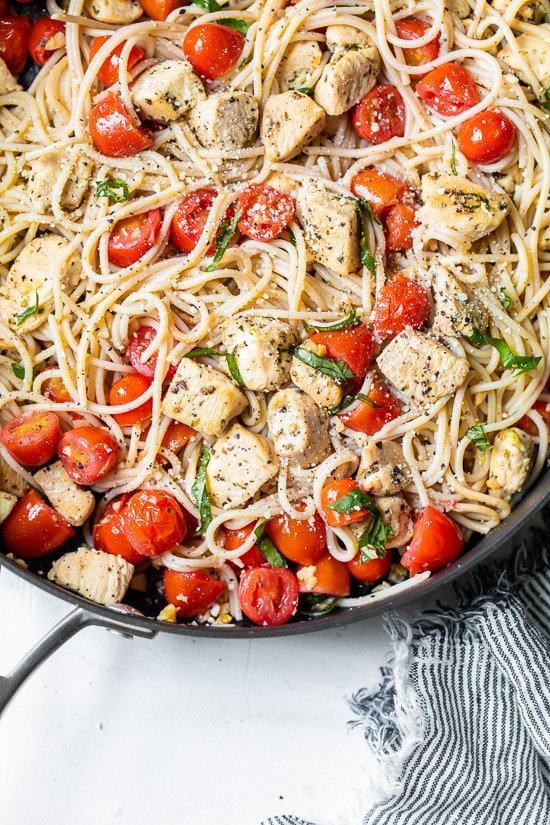 Spaghetti with Sauteed Chicken and Grape Tomatoes in a skillet