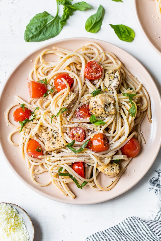 Spaghetti with Sauteed Chicken and Grape Tomatoes on a plate.