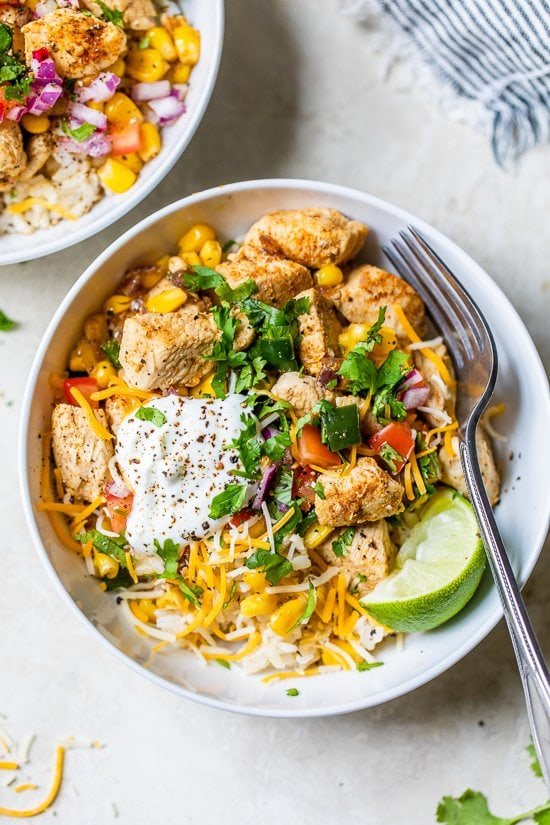 Chicken Taco Poblano Rice Bowls with a fork.