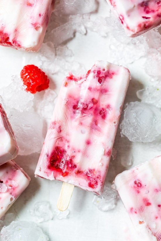 Raspberry Yogurt Ice Pops on ice.