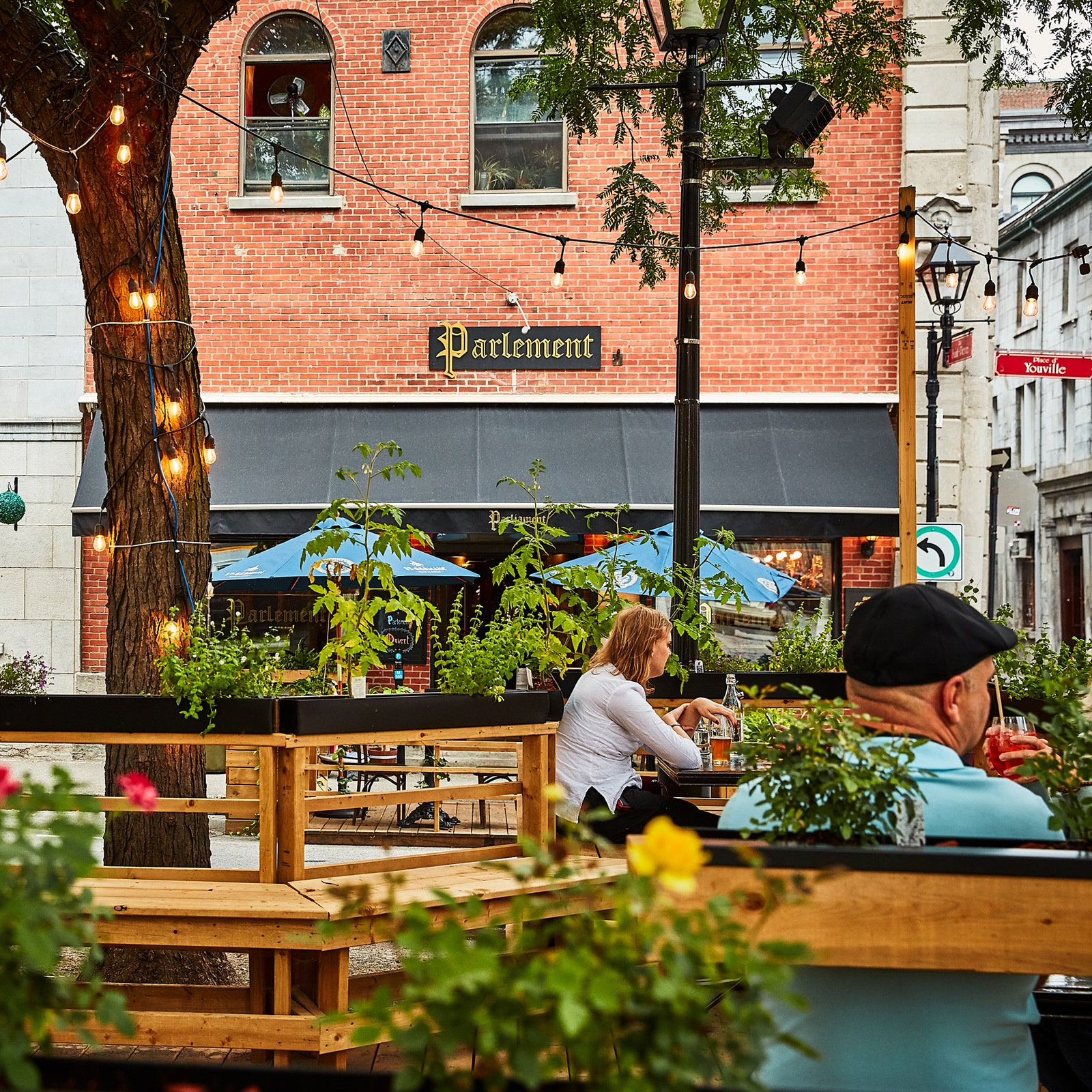 Image may contain Human Person Restaurant Cafe Cafeteria Wood and Plant