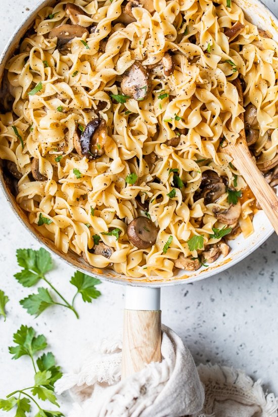 This healthy stroganoff with shiitake, baby portabella, and cremini mushrooms with noodles in a light creamy sauce is a quick and easy meal, perfect for Meatless Mondays!