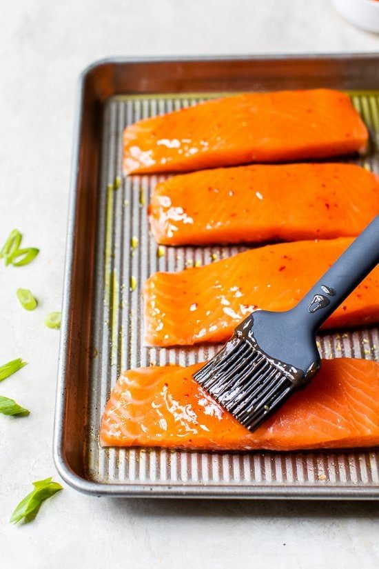 brushing glaze on salmon