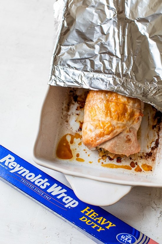 turkey breast in baking dish with foil.